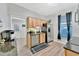 Efficient kitchen space with stainless steel appliances, wood cabinets and black countertops at 7010 N Hubert Ave, Tampa, FL 33614