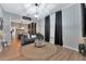 The living room features a gray couch and a round rug at 7010 N Hubert Ave, Tampa, FL 33614