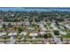Lovely aerial view of the community with mature trees and lush landscaping at 7303 9Th W Ave # 7303, Bradenton, FL 34209
