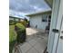 Back patio and manicured landscaping at 7303 9Th W Ave # 7303, Bradenton, FL 34209