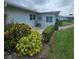 Features a patio with seating area and manicured landscaping at 7303 9Th W Ave # 7303, Bradenton, FL 34209