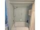 Bathroom with blue mosaic tile shower and toilet at 7303 9Th W Ave # 7303, Bradenton, FL 34209
