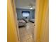 Guest bedroom includes tiled floors, ceiling fan, and two twin beds at 7303 9Th W Ave # 7303, Bradenton, FL 34209