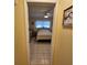 Cozy bedroom with soft natural light featuring tiled floors and a comfortable bed for a restful retreat at 7303 9Th W Ave # 7303, Bradenton, FL 34209
