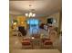 Cozy dining area featuring a glass table, wicker chairs, and natural light at 7303 9Th W Ave # 7303, Bradenton, FL 34209
