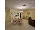 Comfortable dining space next to the kitchen with a chandelier and tile flooring at 7303 9Th W Ave # 7303, Bradenton, FL 34209