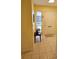 Warm foyer with tiled floors and a sunny yellow wall welcomes you into the home at 7303 9Th W Ave # 7303, Bradenton, FL 34209