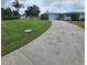 Well-maintained single-story home with lush lawn and inviting driveway at 7303 9Th W Ave # 7303, Bradenton, FL 34209