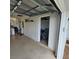 Spacious garage with shelves and a peek into an additional storage area at 7303 9Th W Ave # 7303, Bradenton, FL 34209