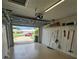 Spacious garage offers storage shelves, tools, and a view to the neighborhood at 7303 9Th W Ave # 7303, Bradenton, FL 34209