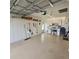 Well lit garage featuring white walls, storage, and a door to the outside at 7303 9Th W Ave # 7303, Bradenton, FL 34209