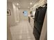 Well-lit kitchen with stainless steel appliances and white tiled floors, offering a clean and modern space at 7303 9Th W Ave # 7303, Bradenton, FL 34209