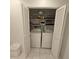 Convenient laundry closet featuring a washer and dryer, maximizing space with bi-fold doors for easy access at 7303 9Th W Ave # 7303, Bradenton, FL 34209