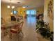 Spacious living room with tile flooring, great natural light, and an inviting dining area at 7303 9Th W Ave # 7303, Bradenton, FL 34209
