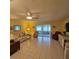 Bright living room with tile flooring and an open flow to a lovely sunroom at 7303 9Th W Ave # 7303, Bradenton, FL 34209