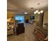 Inviting living room featuring tile floors, lots of seating, and access to a sunroom at 7303 9Th W Ave # 7303, Bradenton, FL 34209