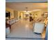 Spacious living room bathed in natural light, showcasing a tile floor and comfortable seating area at 7303 9Th W Ave # 7303, Bradenton, FL 34209