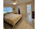 Spacious main bedroom features a ceiling fan, walk-in closet, and ensuite bathroom at 7303 9Th W Ave # 7303, Bradenton, FL 34209