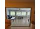 Bright sunroom with multiple windows offering serene outdoor views, perfect for relaxation and entertainment at 7303 9Th W Ave # 7303, Bradenton, FL 34209