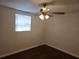 Bright bedroom with wood floors and neutral walls. This room features a ceiling fan at 7307 50Th N Ave, St Petersburg, FL 33709