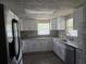 Newly renovated kitchen with white cabinets and stone countertops at 7307 50Th N Ave, St Petersburg, FL 33709