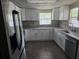 Modern kitchen features stone counters and stainless steel sink at 7307 50Th N Ave, St Petersburg, FL 33709