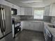 Updated kitchen featuring modern appliances and white cabinets at 7307 50Th N Ave, St Petersburg, FL 33709
