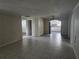 Spacious living room with tiled floors and a glimpse of the kitchen at 7307 50Th N Ave, St Petersburg, FL 33709