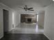 Bright living room with a stone fireplace and tiled flooring at 7307 50Th N Ave, St Petersburg, FL 33709