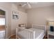 Bright bedroom with neutral walls, wood floors, and a large window, creating a serene atmosphere at 7838 Trail Run Loop, New Port Richey, FL 34653
