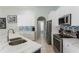 Modern kitchen with a large island, stainless steel appliances, and white cabinets at 7838 Trail Run Loop, New Port Richey, FL 34653
