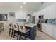 Modern kitchen with a large island, stainless steel appliances, and stylish backsplash at 7838 Trail Run Loop, New Port Richey, FL 34653
