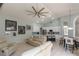 Spacious open floor plan with a kitchen, living room, and dining area; perfect for entertaining at 7838 Trail Run Loop, New Port Richey, FL 34653