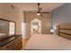 This bedroom features a ceiling fan, hard wood floors and attached bathroom with walk-in shower at 7838 Trail Run Loop, New Port Richey, FL 34653