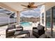 Covered patio with fan overlooking the pool and backyard at 7838 Trail Run Loop, New Port Richey, FL 34653