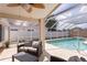 Nice screened-in pool with an outdoor seating area for relaxation and entertaining at 7838 Trail Run Loop, New Port Richey, FL 34653