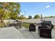 The backyard is spacious and set up with an outdoor dining area and conversation space at 8001 N Ola Ave, Tampa, FL 33604