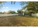 The expansive backyard features a patio area and fenced in perimeter for outdoor entertaining at 8001 N Ola Ave, Tampa, FL 33604