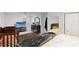 Bedroom featuring tiled floors, a ceiling fan and furnished with multiple dressers and entertainment center at 8001 N Ola Ave, Tampa, FL 33604