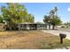 Charming single-story home with stone accents, neutral paint, well-maintained landscaping, and a welcoming front entrance at 8001 N Ola Ave, Tampa, FL 33604