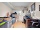Home office space, but needing some organizing, featuring laminate floors, and a large desk at 8001 N Ola Ave, Tampa, FL 33604