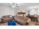 Open-concept living room with wood floors flows into the kitchen and dining area for easy entertaining at 8001 N Ola Ave, Tampa, FL 33604
