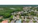 An aerial shot showcasing this vibrant community surrounded by mature trees and landscaping at 8308 Mobile Cir, Weeki Wachee, FL 34613