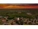 Stunning aerial view of community surrounded by a lush wildlife area at sunset at 8308 Mobile Cir, Weeki Wachee, FL 34613