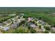 Scenic aerial view of a residential area nestled among mature trees and a tranquil body of water at 8308 Mobile Cir, Weeki Wachee, FL 34613