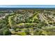Picturesque aerial view of a golf course community with lush greenery, scenic fairways, and serene ponds at 8308 Mobile Cir, Weeki Wachee, FL 34613