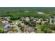 Beautiful aerial view of a residential neighborhood with mature trees and a nearby wildlife management area at 8308 Mobile Cir, Weeki Wachee, FL 34613
