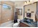 Bathroom with a bathtub, tiled shower, and granite vanity at 8308 Mobile Cir, Weeki Wachee, FL 34613