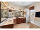 Bathroom boasts a double sink vanity, oversized mirror, and accent lighting at 8308 Mobile Cir, Weeki Wachee, FL 34613