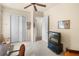 Neutral bedroom featuring a closet, a ceiling fan, and a television at 8308 Mobile Cir, Weeki Wachee, FL 34613